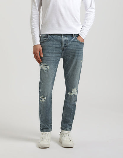 Jeans regular fit con strappi