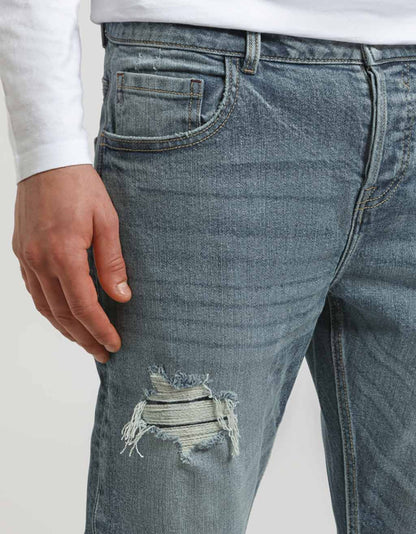 Jeans regular fit con strappi